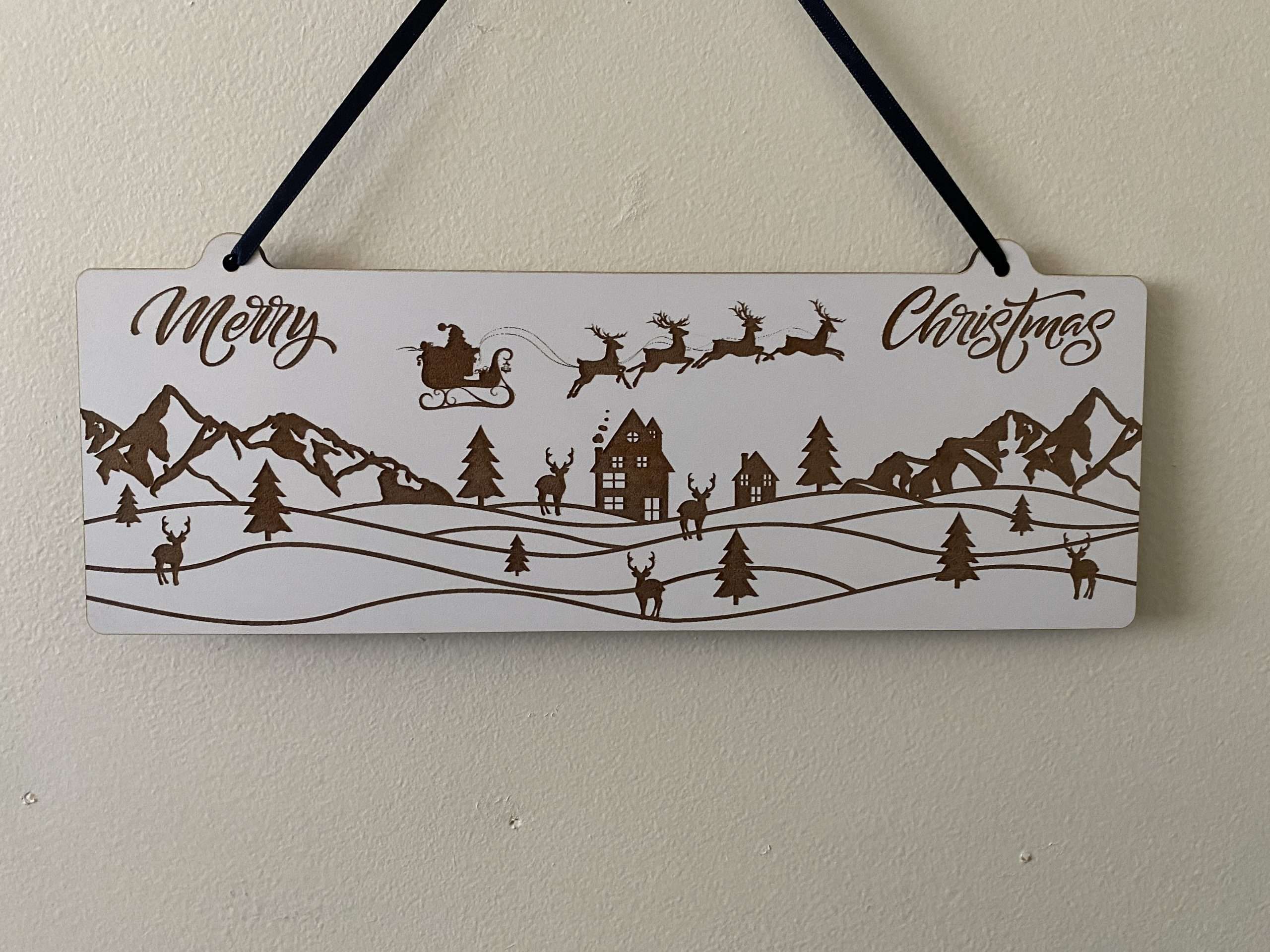 20230925 095312999 iOS scaled Decorative Christmas wall hanger depicting Christmas scene laser cut from 3mm White MDF.
