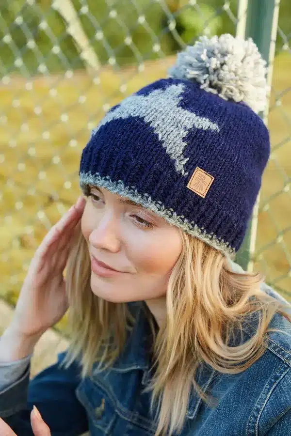 star1 <p style="text-align: center"><strong><span style="font-size: 18pt">Celestial Star Pattern Bobble Hat</span></strong></p> <p style="text-align: center"><span style="font-size: x-large"><span id="span_description">Shine like a star in our new celestial design. </span></span></p> <p style="text-align: center"><span style="font-size: x-large"><span id="span_description">These bobble hats are fleece lined to keep your ears extra warm.</span></span></p> <h3 id="Sub_Title" style="text-align: center"><strong><span style="font-size: x-large">Women's knitted wool bobble hat.</span></strong></h3> <h3 style="text-align: center"><strong><span style="font-size: x-large"> Grey star motif in navy blue background. </span></strong></h3> <h3 style="text-align: center"><strong><span style="font-size: x-large">Fleece lined for extra comfort. </span></strong></h3> <h3 style="text-align: center"><strong><span style="font-size: x-large">Handmade with love.</span></strong></h3> <ul style="text-align: center"> <li><span style="font-size: x-large">100% Wool</span></li> <li><span style="font-size: x-large">Fleece lined around the forehead for comfort</span></li> <li><span style="font-size: x-large">Hand knitted</span></li> <li></li> </ul> <p style="text-align: center"><b>Colours and patterns may vary slightly due to the handmade nature of this product. </b></p> <div class="row"> <div id="item_price" class="col-sm-12"> <p style="text-align: center"><b>No two items are exactly the same!</b></p> <p style="text-align: center"><b>Handwarmers and headband available in this pattern.</b></p> <p style="text-align: center">All colours are represented as closely as possible, we cannot guarantee 100% accuracy.</p> <h1 style="text-align: center"><strong>FREE P&P</strong></h1> </div> </div>