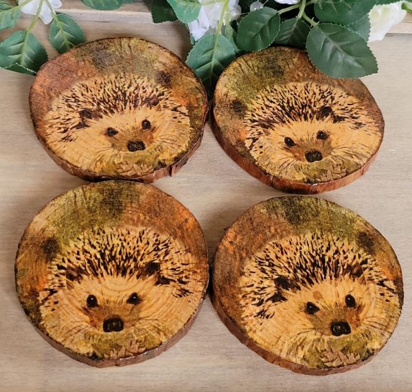 round wood coasters with Hedgehog detail.