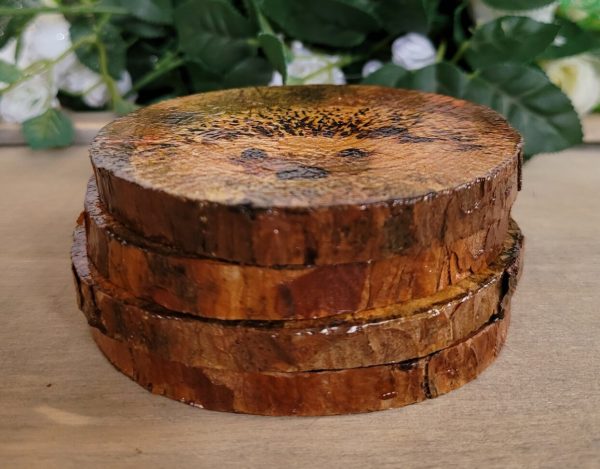 four round wood slices stacked on top of one another