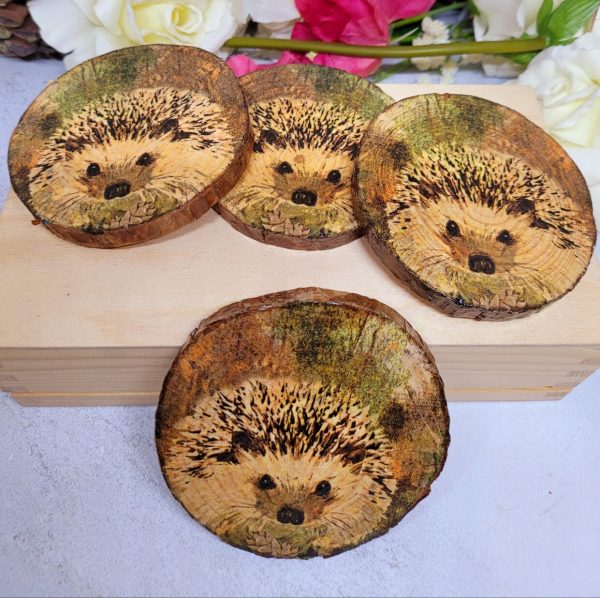 round wood coasters with Hedgehog detail.
