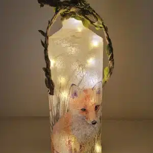 Lit up square gin bottle with fox detail and jute twine with leaves. Cork LED lights