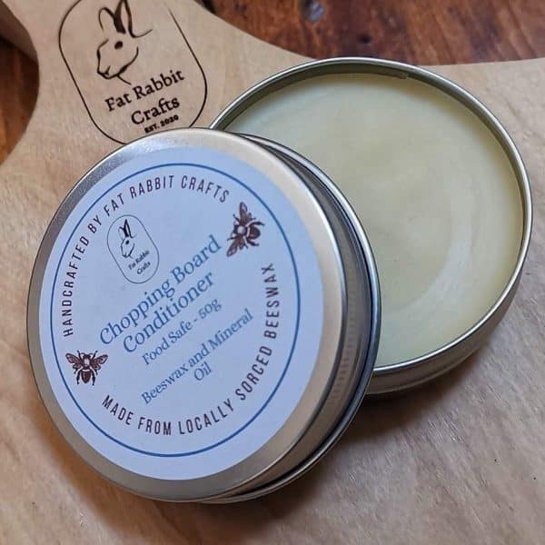 a open tin showing the bees wax conditioner.